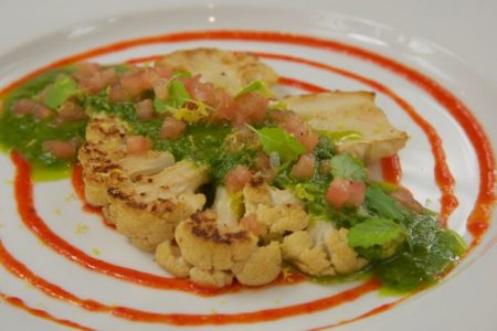 Cauliflower steak with roasted red pepper puree, chimichurri and tomato concasse