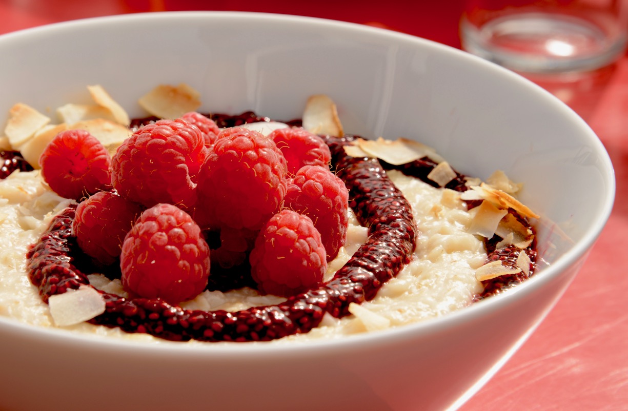Oatmeal porridge with coconut, raspberry coulis with chia seeds