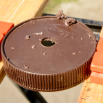 Lid with hole for airlock grommet