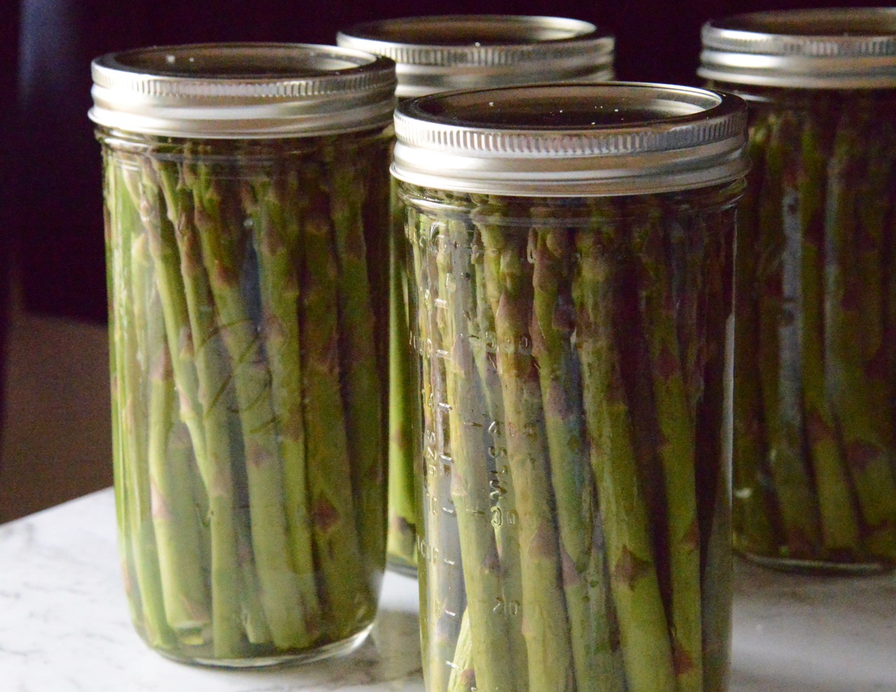 4 jars of Homemade pickled Asparagus in pickling liquid