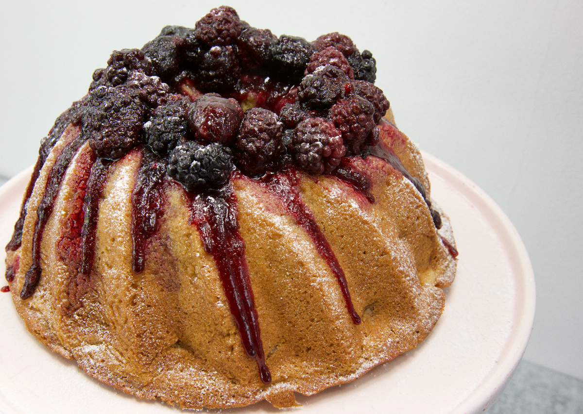 Apple cake decorated with blackberries